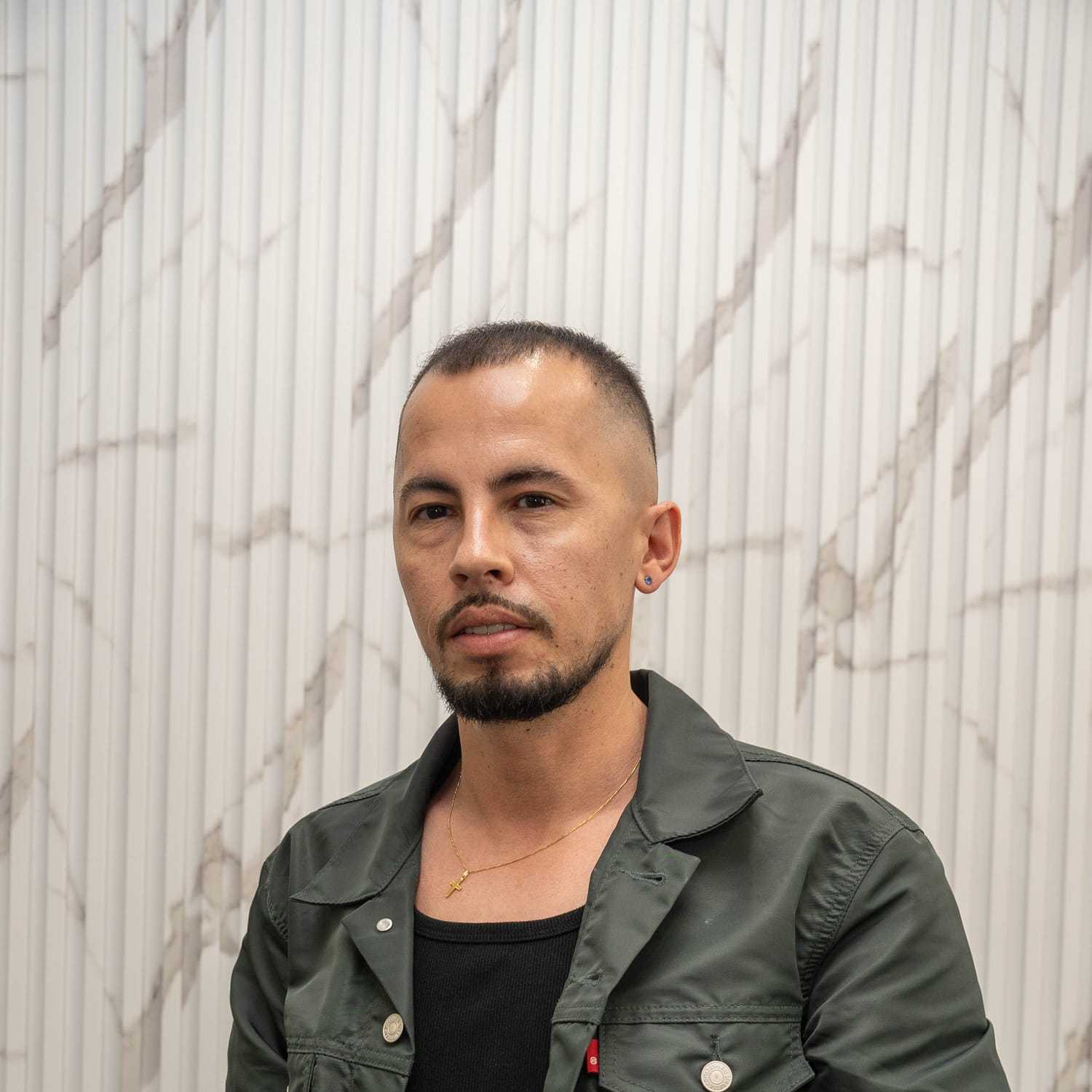 Portrait of Alex, a professional stylist at A&D Salon, showcasing their expertise and style.