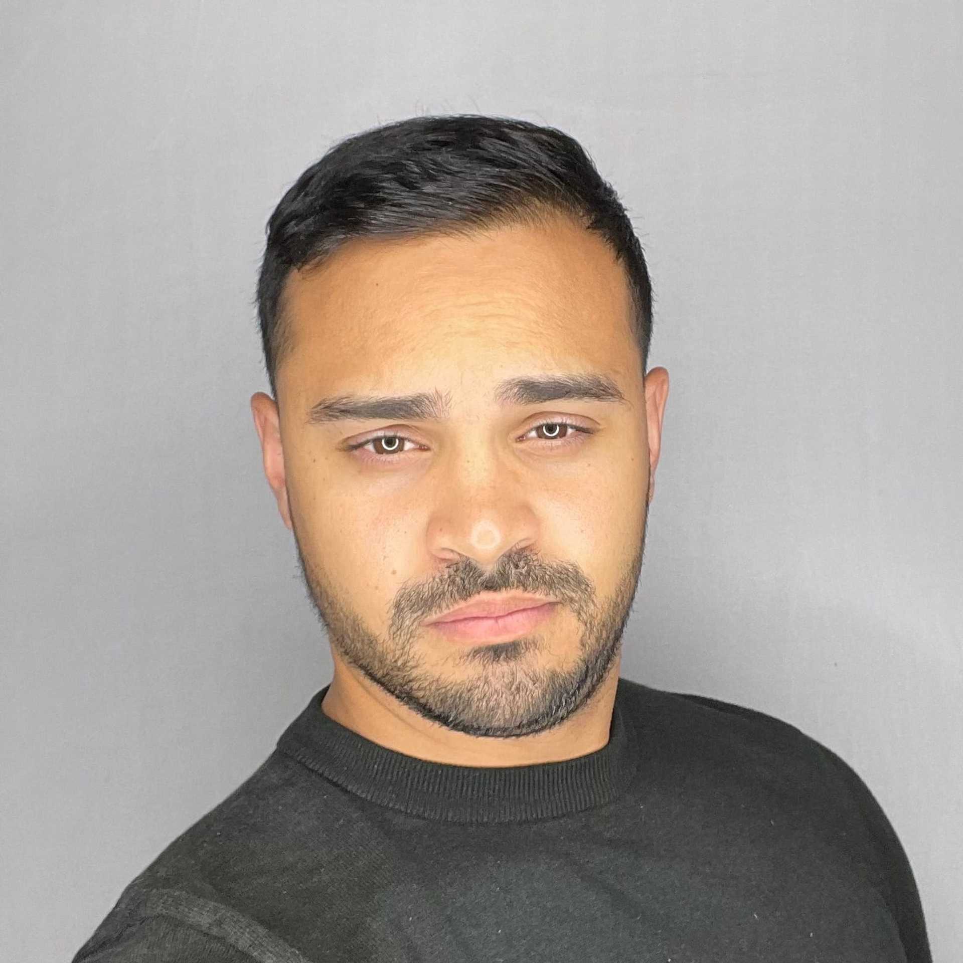 Portrait of Anthony, a professional stylist at A&D Salon, showcasing their expertise and style.