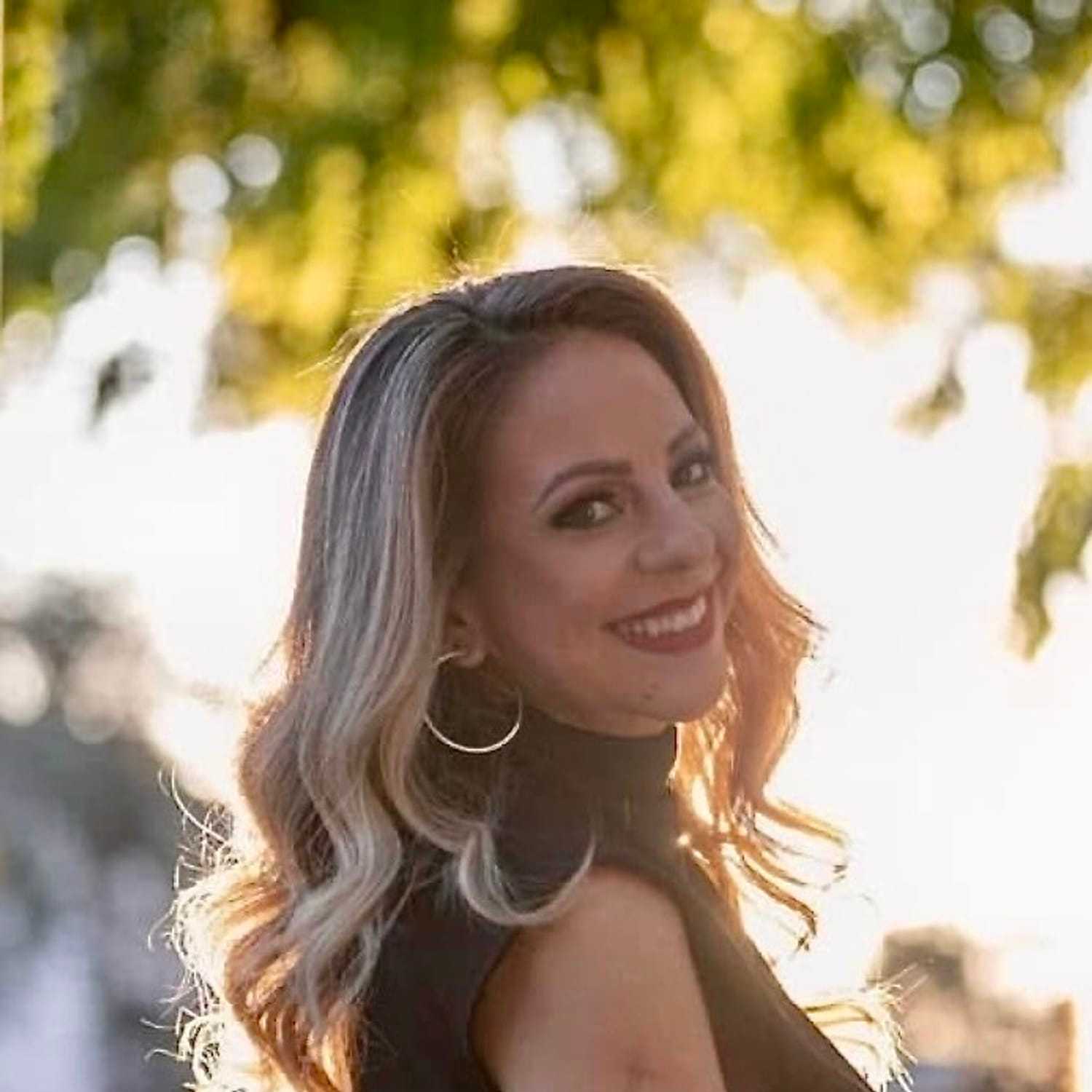 Portrait of Cecilia, a professional stylist at A&D Salon, showcasing their expertise and style.