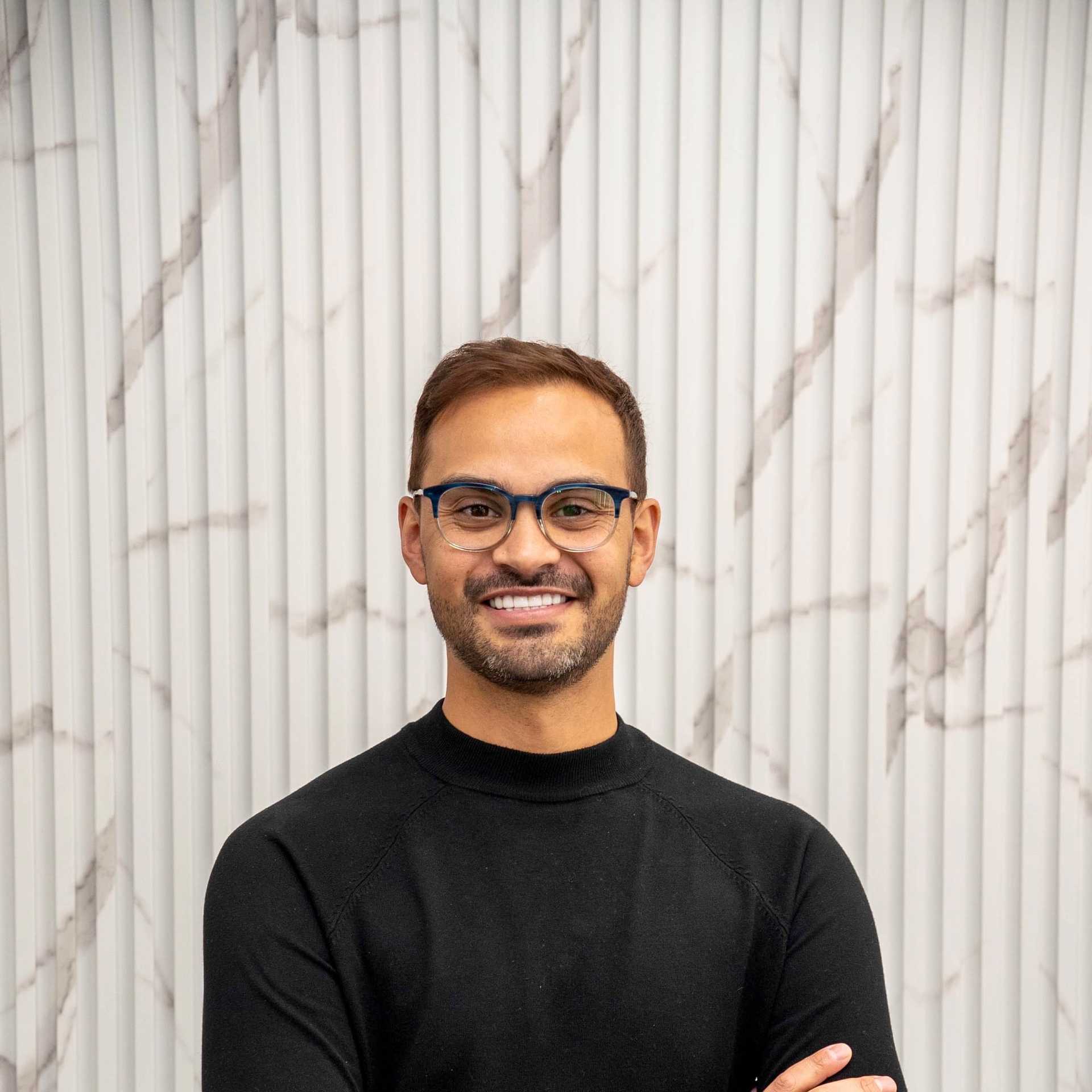 Portrait of Anthony, a professional stylist at A&D Salon, showcasing their expertise and style.