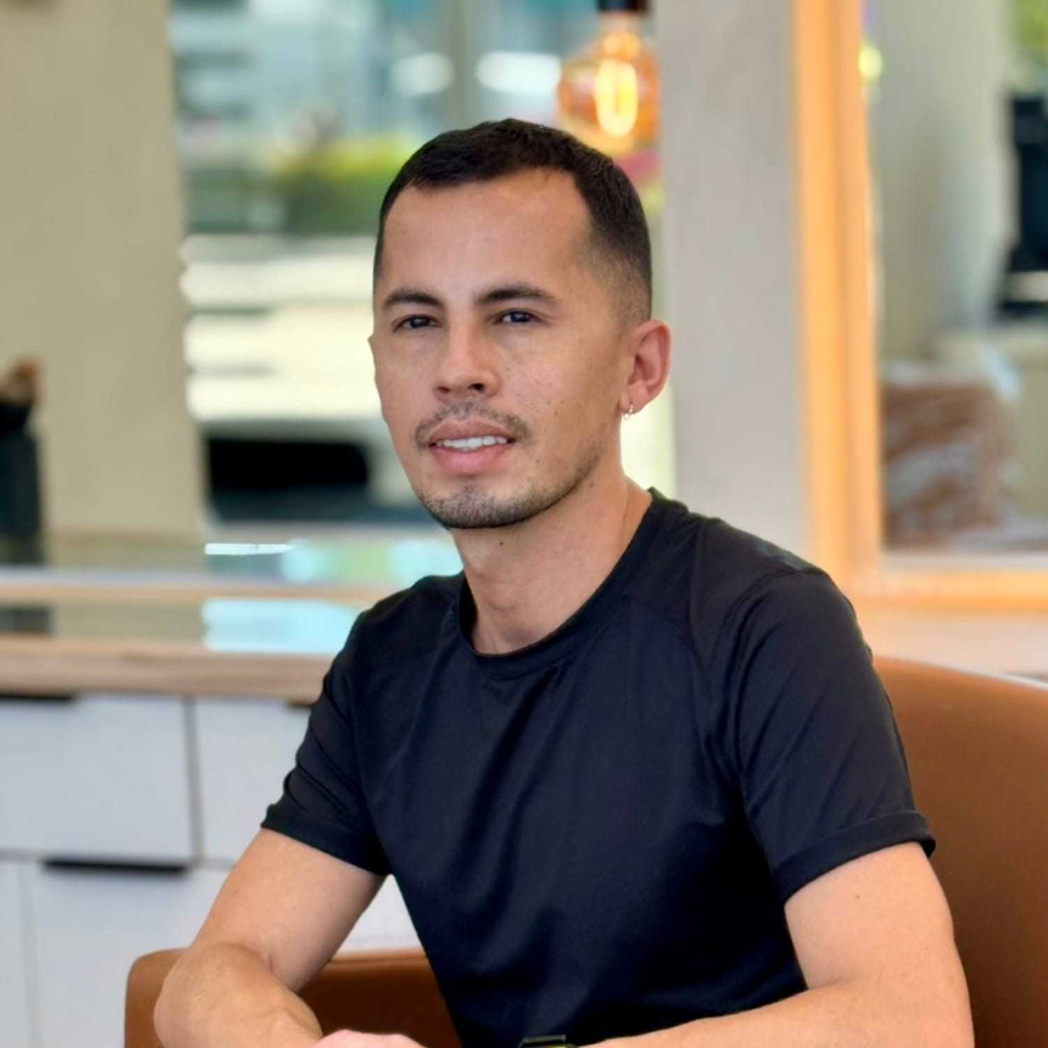 Portrait of Alex, a professional stylist at A&D Salon, showcasing their expertise and style.