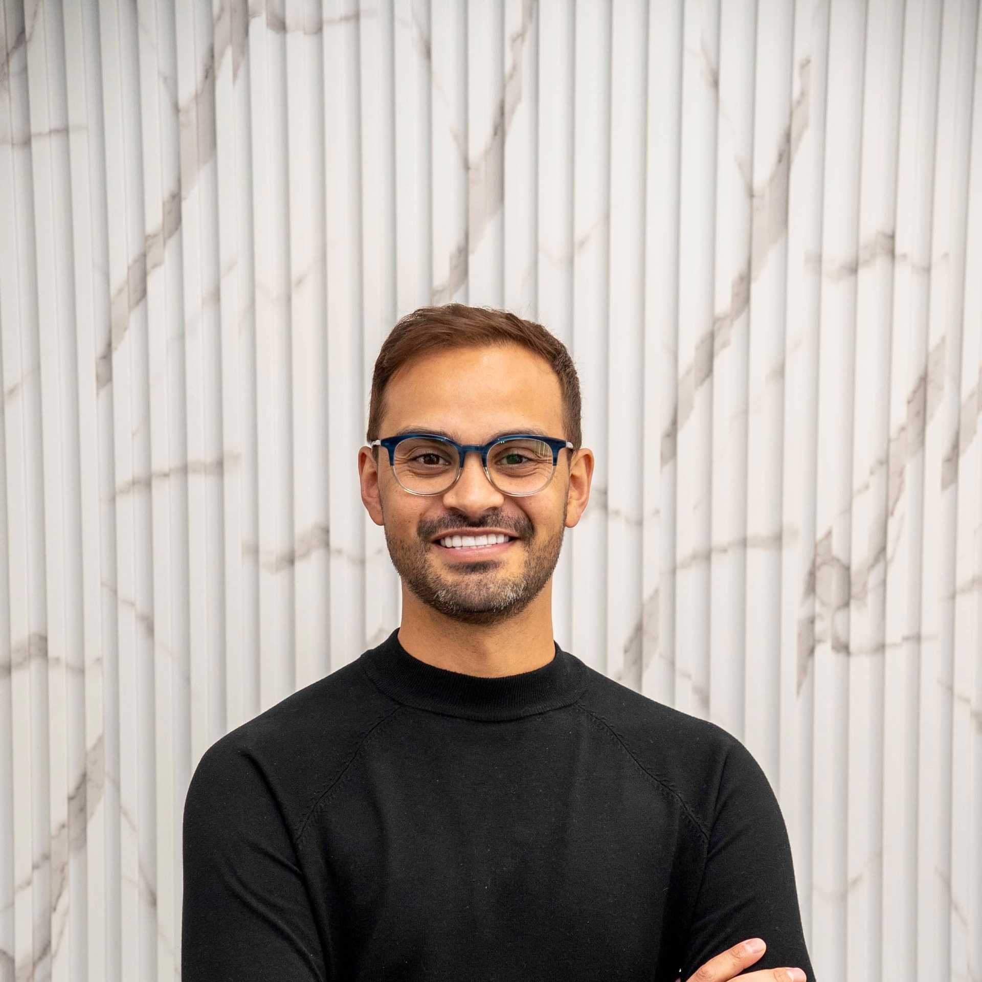 Portrait of Anthony, a professional stylist at A&D Salon, showcasing their expertise and style.