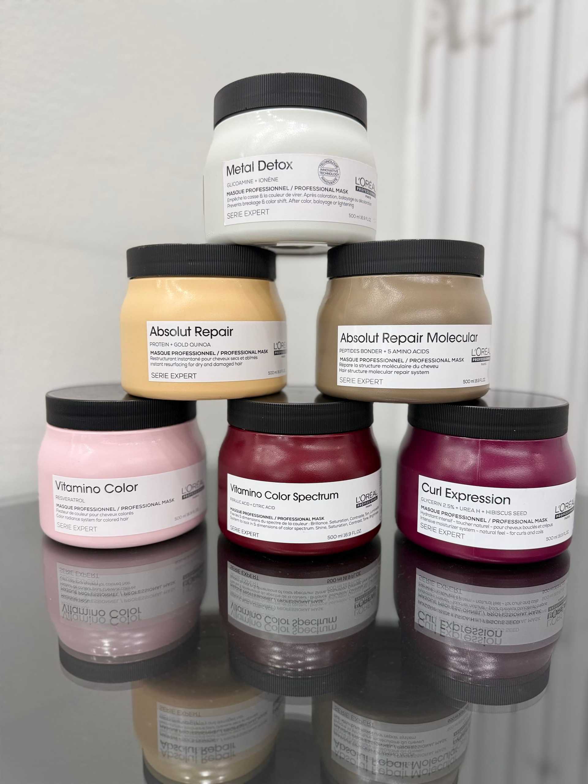 Haircare products on display: Metal Detox, Absolut Repair, Vitamino Color, Curl Expression.