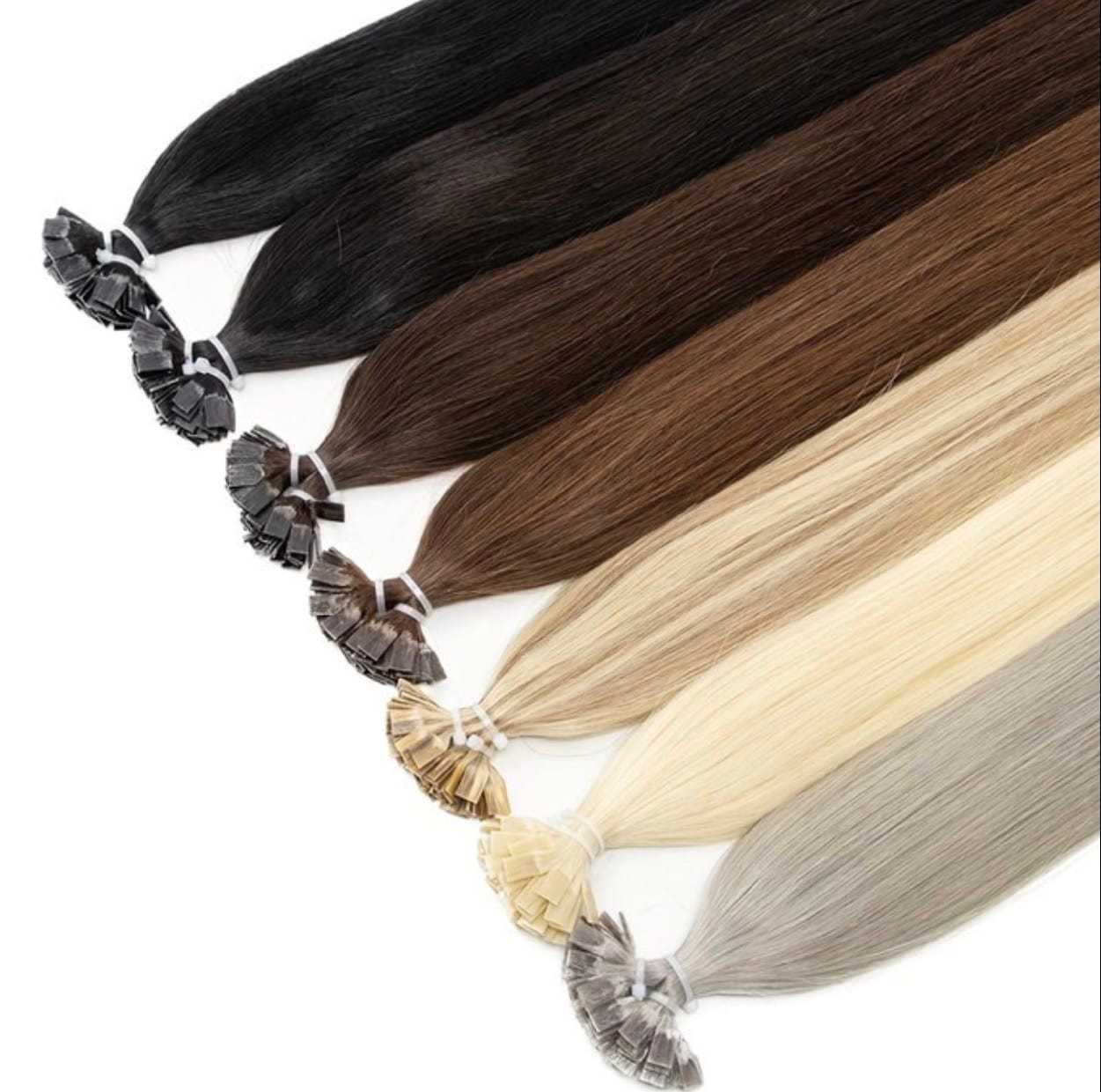 Variety of hair extension colors from black to light blonde on display.