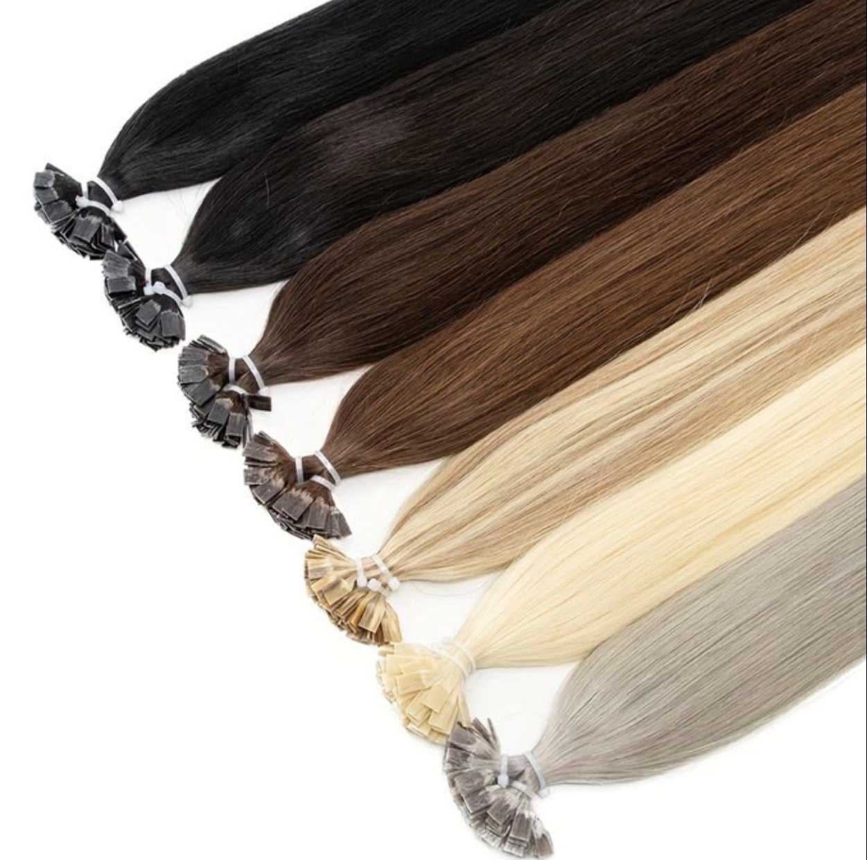 Variety of hair extension colors from black to light blonde on display.