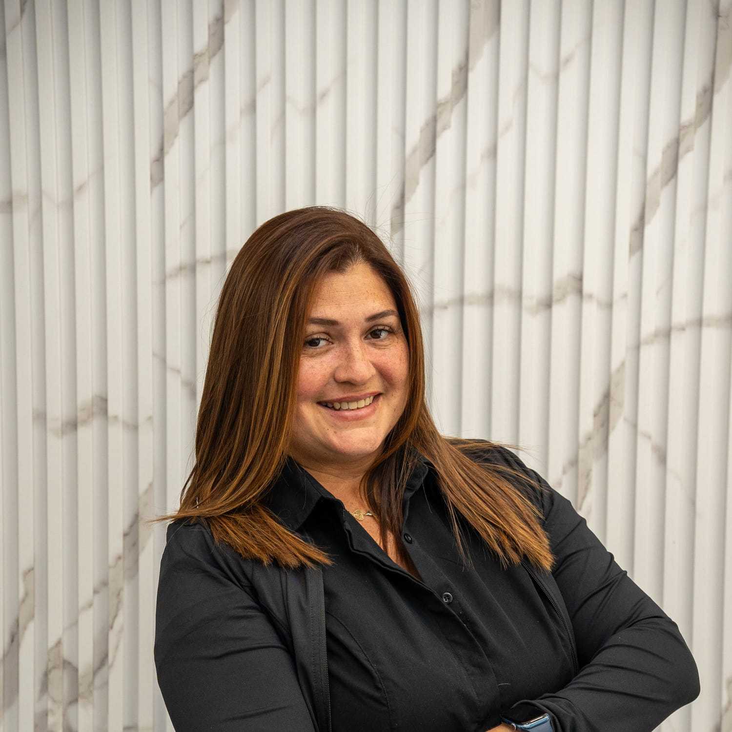 Portrait of Carmen, a professional stylist at A&D Salon, showcasing their expertise and style.