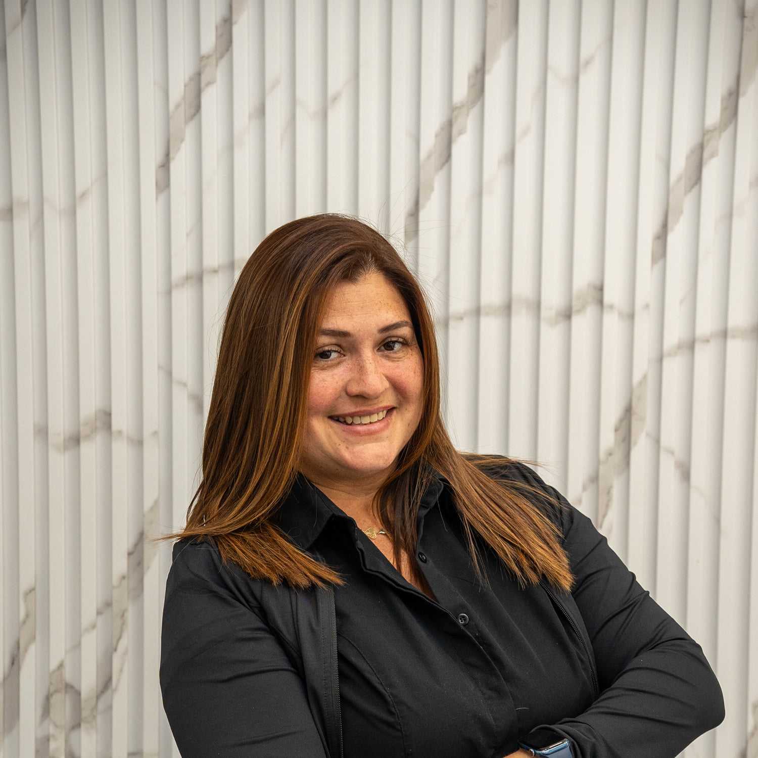 Portrait of Carmen, a professional stylist at A&D Salon, showcasing their expertise and style.